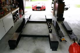 Bay 7 houses our biggest lift in the shop for vehicles up to 14,000 lbs! 220 Garage Lifts Ideas Garage Garage Workshop Car Ramps