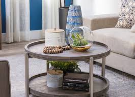 Add a flowerless arrangement to your coffee table for a crisp and clean display that still has a touch of feminity. How To Style A Coffee Table Tabletop Decor Ideas Living Spaces