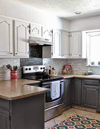 This technique works particularly well if there's a need to ground the bottom cabinets using a darker color, or if you're looking to create a cozier feel in your kitchen by pulling the ceiling down with a darker tone for the top cabinets. Kitchens With Dark Cabinets On Bottom And Light On Top Decorkeun