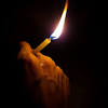 Candle light glowing in woman's hands. 3