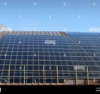 Curved roof with a series of solar panels Stock Photo - Alamy
