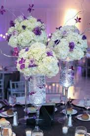 Purple And White Wedding Centerpieces By Jillian Wedding Floral Centerpieces Wedding Centerpieces White Wedding Centerpieces