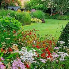 A Peek Through The Kaleidoscopic Borders In Robert Bailey Scott S Garden One Of Our 2018 Gardens Of The Year Garden Inspiration Garden Design Outdoor Gardens