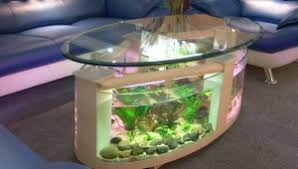 The tank itself is made from acrylic, but the table top is made from glass. Modern Fish Tank Coffee Table