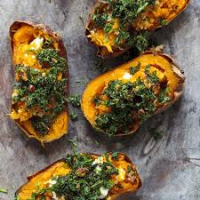 Stuff the sweet potatoes with about 2 tbsp of pesto, sausage, tomatoes, and sprinkle with some pine nuts + basil for garnish. Stuffed Sweet Potatoes With Kale Walnut Pesto Flannerys