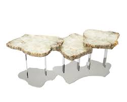 Two drawers and a shelf on the sofa table offer ample storage space. Brenda Houston Light Agate Nesting Tables Houston Design Living Room Coffee Table Gold Coffee Table