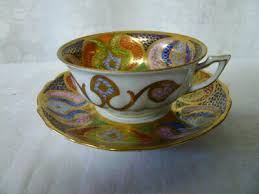Purple flowers are green edged, deep rose flowers are light blue edged, blue. Cups Saucers Austria Porcelain Vatican