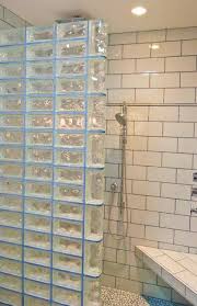 Glass brick walls are used to divide space for functional or privacy reasons, providing decoration without blocking the passage of light. Glass Block Walls For Bright And Modern Bathroom Design