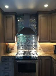 Many use stainless steel backsplash tiles to frame an oven with a fan, but you can also use stainless steel tiles, like hexagon shapes, to frame any kitchen. Stainless Steel Backsplash Houzz