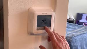 Put one finger on the '+' button . How To Unlock Honeywell Thermostat Step By Step To Unlock It