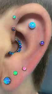 cute opal multiple ear piercing ideas for women for daith tragus forward helix cartilage earings piercings ear piercings multiple ear piercing