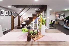 Although The New Staircase Descends Into The Middle Of The Basement Its Openness Makes The Space Feel Unified R Basement Layout Basement Stairs New Staircase