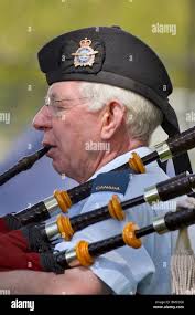 Male playing bagpipes hi-res stock photography and images