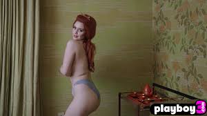 Huge natural tits redhead MILF Minxie posed naked after passion striptease