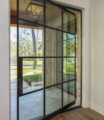 The framing around industrial style steel doors can be pencil thin (unlike wood, which requires a large beam to support a door). Steel Window And Door Design Steel Doors And Windows Steel Doors Steel Frame Doors