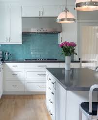Kitchen With White Cabinets Gray Countertops Turquoise Blue Subway Tile Backsplash Metson Urman Ar Grey Countertops Gray Kitchen Countertops Kitchen Design