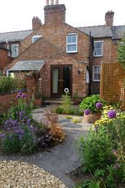 A redesign of the ground floor layout has allowed for a new kitchen diner that opens. Eximia Garden Design Professional Garden Design In Warwickshire The Cotswolds Victorian Terrace Garden