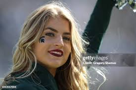 Matt Dotson of the Michigan State Spartans throws a frisbee for Zeke...  News Photo