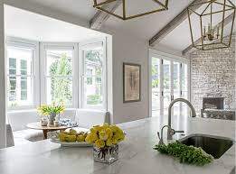 This kitchen offers a new twist on arts and crafts style. Remodeled White Kitchen With Vaulted Ceiling Beams Home Bunch Interior Design Ideas