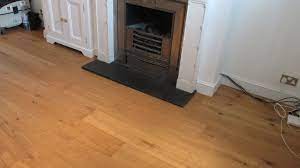 We Fitted A Slightly Narrower Border Around This Fireplace To Complement The Oak Wood Flooring Visit Our W Stairs Cladding Oak Wood Floors Floor Installation