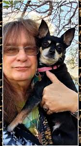 Does your dog have a theme song? My dog Daisy's is, "Precious pretty puppy  baby angel walking down the steet. Sayin' hi to everyone she knows and  everyone she meets. Cause she's