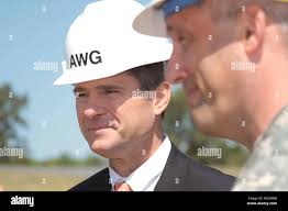 Mike McCarthy, with Newport News, Va., based W.M. Jordan, talks with Col.  Paul Olsen, commander of the Norfolk District, U.S. Army Corps of  Engineers, about the Asymmetric Warfare Group's battle laboratory complex