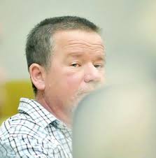 Former fire fighter found not guilty of wife's murder sues over case