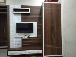 Wooden almirah designs for bedroom reference cupboard design ideas gallery wardrobe playwood wadrobe with cabinets also latest reclaimed wood full source bed own interior cupboards stylish dressing bedrooms indian homes home combo in wall small rooms size of retailers sliding image. Lcd With Almirah Brown And White Combination Beautiful Design And Space Proof You Won T See More Wall Tv Unit Design Lcd Wall Design Tv Unit Furniture Design