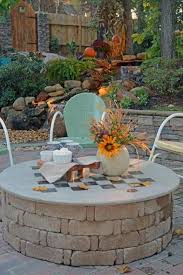 Some fire pits come with a cover plate so that you can completely conceal the pit itself and use the entire surface as a table. Diy Fire Pit Cover Game Table All Things Heart And Home Backyard Fire Fire Pit Backyard Patio Fireplace Diy