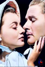 Olivia de Havilland and Errol Flynn !