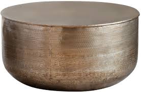 This round coffee table is a foolproof accent table for the side of your living room or as a small coffee table in front of the sofa. Ashta Embossed Metal Round Coffee Table Coffee Tables