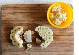 Cut each tomato in half through the stem end and distribute them around the burrata. Halving Garlic Crosswise Halting Time