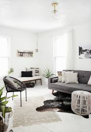 A living room with chic minimal approaches by the floor vases. Minimal Living Room The Merrythought