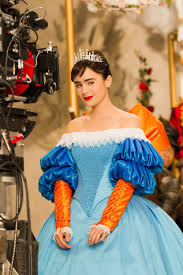 After she spends all her money, an evil enchantress queen schemes to marry a handsome, wealthy prince. The Stunning Costumes Of Mirror Mirror Lily Collins Snow White Fashion Film Lily Collins