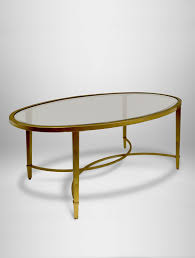 Cast an eclectic profile with this elongated oval coffee table. Copia Glass Coffee Table Gold West Coast Event Productions Inc