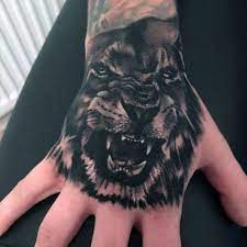 See more ideas about tattoos, tattoos for guys, hand tattoos. Top 51 Realistic Lion Tattoo Ideas 2021 Inspiration Guide Lion Hand Tattoo Men Lion Tattoo Hand Tattoos For Guys