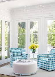 Maybe you would like to learn more about one of these? Blue Print Swivel Chairs With Round White Ottoman Contemporary Living Room