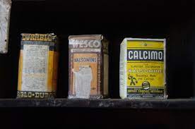 Is what you're scraping off the calcimine itself, or only the layers above? Whitewash Wikipedia