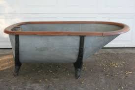 The clawfoot bathtub buying guide from kingston brass. Antique Tub Metal Bathtub With Claw Feet And Oak Wood Trim Lqqk Oak Wood Trim Wood Trim Oak Wood