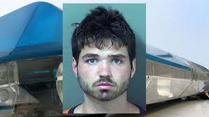 NEW: Man robs woman, 77, at Wellington plaza, arrested at sober home