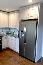 Styled with lighter countertops and bold, bright finishes, the darker cabinetry does not seem as dark anymore. Over Cabinet Lighting Makes This New Kitchen Shine Cliqstudios