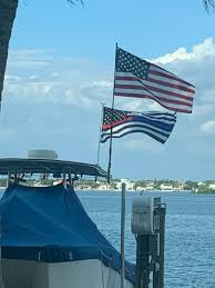 What does a black flag with red stripe in the middle mean. Thin Blue Line Flag Thin Red Line Flag Blue Stripe American Flag Red Stripe American Flag Made In The Usa Flags Com
