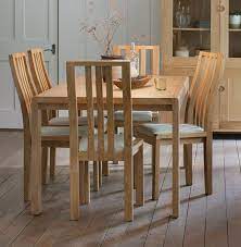 Dining tables & chairs 256 other 207 chairs,. Ercol Bosco Oak Extending Dining Table And Cream Chairs Cfs Furniture Uk