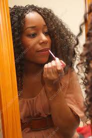 Young black woman putting