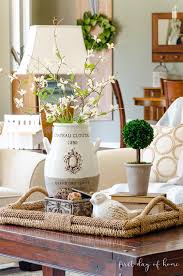 Traditional coffee tables are also used for eating. How To Create An Elegant Look With Coffee Table Decor Decorating Coffee Tables Coffee Table Decor Tray Table Decorations