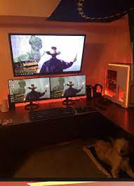 Tv Mounted Above Dual Monitors Pc Battlestation Tv Mounted Computer Desk Setup Gaming Room Setup