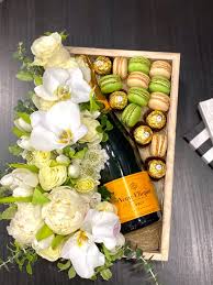 Maybe you would like to learn more about one of these? Flowers Macarons Candies And Champagne Gift Boxes