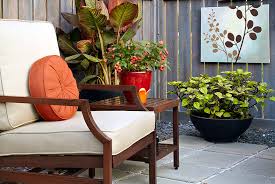 A covered dining area offers a place to enjoy meals, while a pergola gives shade for lounge chairs nearby. Patio Design Ideas Garden Gate