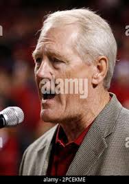 Jackie Smith, St. Louis Cardinals tight end, right, snares a pass from  quarterback Jim Hart for a 55-yard gain which set up the go-ahead touchdown  in the fourth period of a game