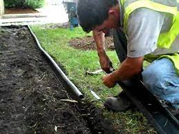 Place the stake into the soil so that it is right next to the top of the edging, and the pointed tip is going towards the v shape at the bottom. How To Install Master Mark Coiled Edging Youtube
